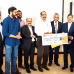 Handing over the voluntary contribution from the Indian Doctors Community of Qatar